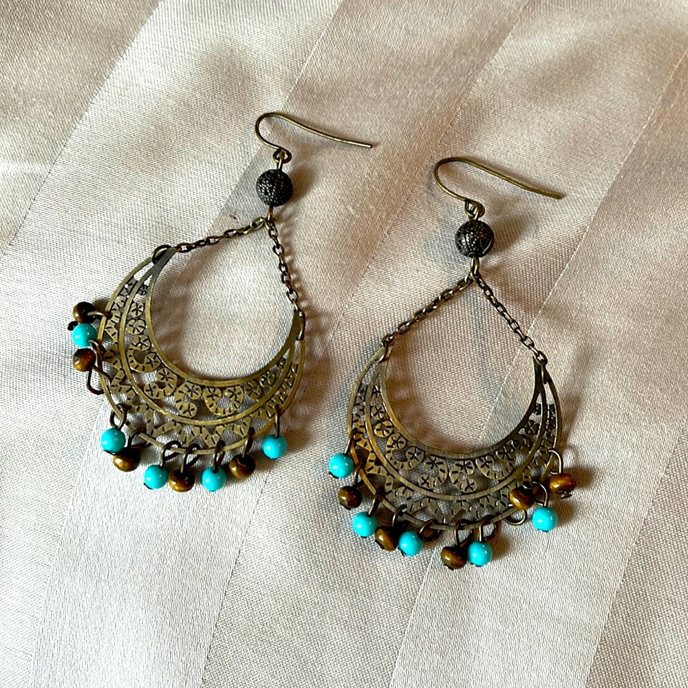 Brown and teal beaded earrings with chrome accents
